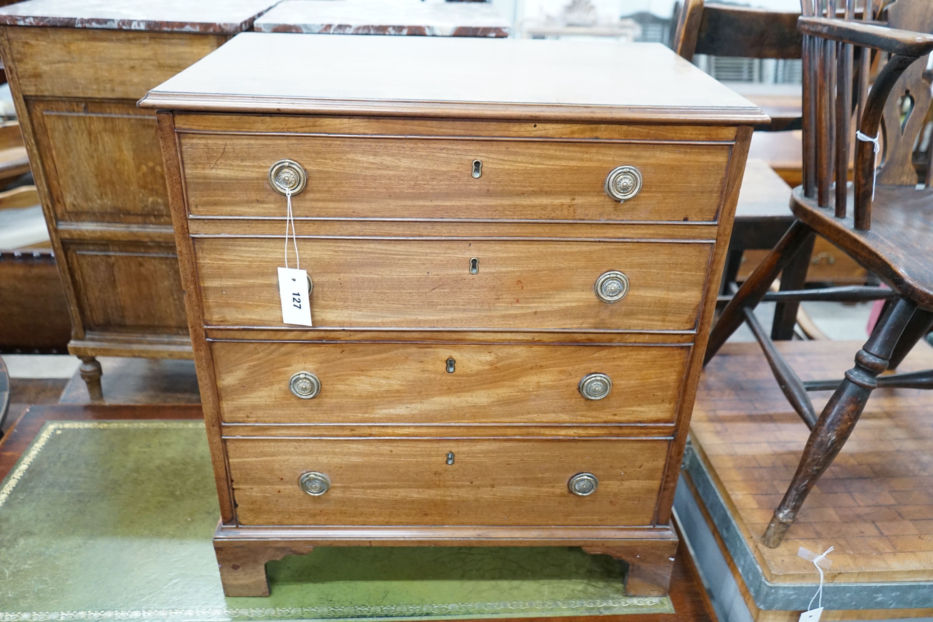 A George III mahogany hinged top commode with dummy drawer front and brass handles, width 66cm, depth 42cm, height 74cm